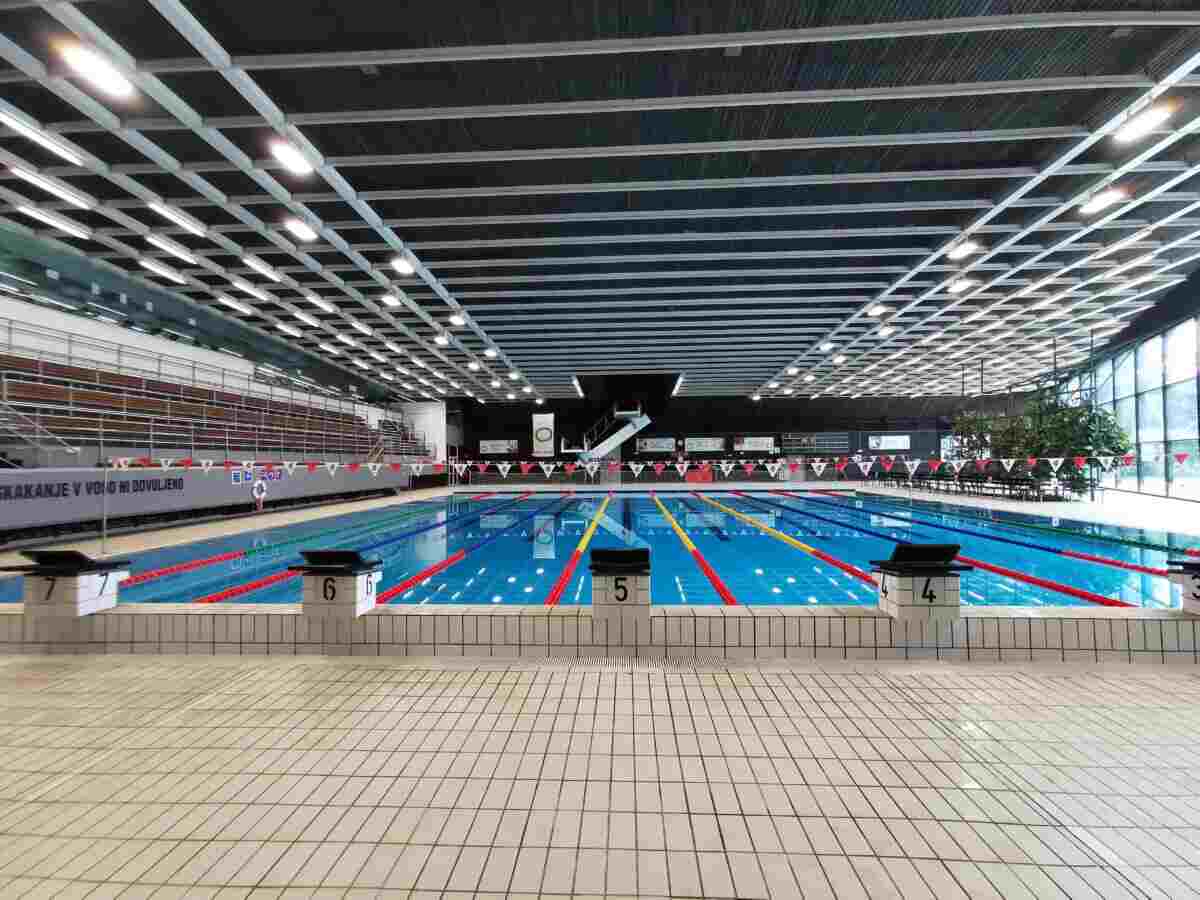 Modern indoor Olympic swimming pool in Tivoli Ljubljana with competition lanes and spectator seating
